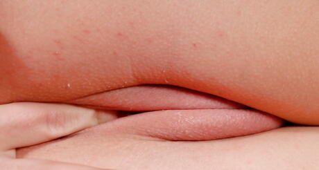 Svelte blonde babe Sera Passion exposing tiny tits and masturbating 